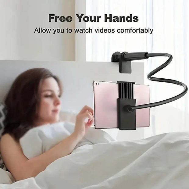 Woman in bed using a flexible gooseneck tablet holder.